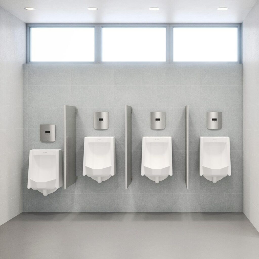 Bathroom urinals featuring Sloan's CX sensor flushometers.